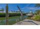 Enjoy waterfront living with a private boat dock and lift, offering direct access to serene waters and endless boating adventures at 3491 Bayou Sound, Longboat Key, FL 34228
