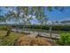 This dock is perfect for boaters, with a boat lift for easy access to the water and a peaceful view of the surrounding nature at 3491 Bayou Sound, Longboat Key, FL 34228