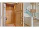 View of the home elevator with wood paneling, carpet, and access to the staircase at 3491 Bayou Sound, Longboat Key, FL 34228
