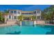 Exterior view of a home featuring a pool and beautiful back yard at 3491 Bayou Sound, Longboat Key, FL 34228