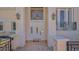 The home features an elegant front door with decorative windows and sidelights under lantern-style lighting at 3491 Bayou Sound, Longboat Key, FL 34228