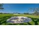 Beautifully maintained golf course with lush green fairways, mature trees, and challenging sand traps for the perfect game at 3491 Bayou Sound, Longboat Key, FL 34228