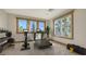 Bright home gym features a treadmill, weights, and ample natural light from large windows at 3491 Bayou Sound, Longboat Key, FL 34228