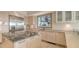 Bright kitchen featuring a marble island, stainless steel refrigerator, and updated cabinetry at 3491 Bayou Sound, Longboat Key, FL 34228