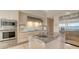 Gourmet kitchen with island, stainless steel appliances, and custom cabinets at 3491 Bayou Sound, Longboat Key, FL 34228