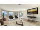Bright living room with large windows and water views at 3491 Bayou Sound, Longboat Key, FL 34228