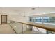 Bright loft area overlooking main living area and water view at 3491 Bayou Sound, Longboat Key, FL 34228
