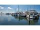 Picturesque marina scene featuring numerous boats docked on a sunny day with reflections in the water at 3491 Bayou Sound, Longboat Key, FL 34228