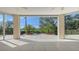 A beautiful patio area with an amazing view of the water, lined by lush tropical foliage at 3491 Bayou Sound, Longboat Key, FL 34228