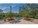A high angle of a gorgeous spa with a view of the water and an elegant palm tree at 3491 Bayou Sound, Longboat Key, FL 34228
