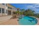 An attractive pool with an attached spa situated on a beautiful property with a picturesque waterway view at 3491 Bayou Sound, Longboat Key, FL 34228