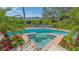 Inviting pool with a spa, surrounded by lush tropical landscaping at 3491 Bayou Sound, Longboat Key, FL 34228