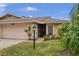 Inviting single-story home featuring a screened entryway, a well-kept lawn, and tasteful landscaping at 3502 Wilkinson Woods Dr # 7, Sarasota, FL 34231