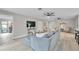 Comfortable living room features a large sectional sofa, modern decor, and neutral paint colors at 3502 Wilkinson Woods Dr # 7, Sarasota, FL 34231
