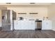 Modern kitchen appliances, white cabinets, stainless steel appliances, and wood-look flooring at 353 Hillview Rd, Venice, FL 34293