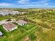 Aerial view of home showing a large fenced yard with trees to the east at 3631 Pebble Ter, Punta Gorda, FL 33980