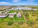 Aerial view of home showing a large fenced yard and community lake at 3631 Pebble Ter, Punta Gorda, FL 33980