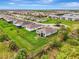Aerial view of home showing a large fenced yard with green grass in a community at 3631 Pebble Ter, Punta Gorda, FL 33980