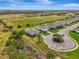 An aerial shot of multiple homes in a suburban neighborhood, including mature landscaping and manicured lawns at 3631 Pebble Ter, Punta Gorda, FL 33980