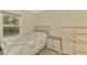 This bedroom features a window, hard surface floors and a dresser at 3631 Pebble Ter, Punta Gorda, FL 33980