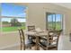 Cozy breakfast nook featuring wood table set with views of the backyard at 3631 Pebble Ter, Punta Gorda, FL 33980