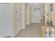Bright foyer featuring tile floors and a white front door at 3631 Pebble Ter, Punta Gorda, FL 33980