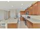 Spacious kitchen with stainless steel appliances and an expansive granite island at 3631 Pebble Ter, Punta Gorda, FL 33980