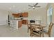 Bright kitchen with island, stainless appliances, and adjacent dining area at 3631 Pebble Ter, Punta Gorda, FL 33980