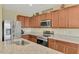 Updated kitchen with stainless steel appliances and granite countertops at 3631 Pebble Ter, Punta Gorda, FL 33980