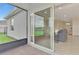View from screened patio, through sliding glass door into living room with tile floors at 3631 Pebble Ter, Punta Gorda, FL 33980