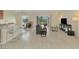 Open-concept living space featuring tile floors and a view to the backyard at 3631 Pebble Ter, Punta Gorda, FL 33980