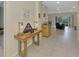 Open-concept living space with tile floors and access to the outdoors at 3631 Pebble Ter, Punta Gorda, FL 33980