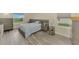 Serene main bedroom showcasing hardwood floors and natural light from the window at 3631 Pebble Ter, Punta Gorda, FL 33980