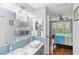 Stylish bathroom connected to bedroom featuring double sinks and modern fixtures at 4240 Marseilles Ave # 3248, Sarasota, FL 34233