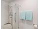 Modern bathroom with a tiled glass shower, a showerhead, and decorative towel rack at 4240 Marseilles Ave # 3248, Sarasota, FL 34233