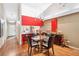 Dining area with a glass table, seating for four, adjacent to the kitchen and living room at 4240 Marseilles Ave # 3248, Sarasota, FL 34233