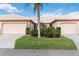 Welcoming single story home with a well-maintained lawn and colorful flowerbeds in front at 4240 Marseilles Ave # 3248, Sarasota, FL 34233
