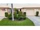 Charming single-story home featuring a beautiful landscaped front yard, neutral color palette and an attached garage at 4240 Marseilles Ave # 3248, Sarasota, FL 34233