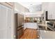 Spacious kitchen with stainless steel appliances, white cabinetry, and ample counter space at 4240 Marseilles Ave # 3248, Sarasota, FL 34233