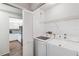 Convenient laundry area with modern washer and dryer, easily accessible near the kitchen at 4240 Marseilles Ave # 3248, Sarasota, FL 34233