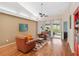 Bright living room with hardwood floors, vaulted ceilings, cozy seating and sliding glass doors to the backyard at 4240 Marseilles Ave # 3248, Sarasota, FL 34233