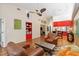 Open-concept living room with hardwood floors, vaulted ceilings, adjacent to the dining area at 4240 Marseilles Ave # 3248, Sarasota, FL 34233