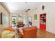 Bright living room with hardwood floors, vaulted ceilings, cozy seating and sliding glass doors to the backyard at 4240 Marseilles Ave # 3248, Sarasota, FL 34233