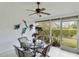 Inviting patio with a ceiling fan, table with seating, offering a relaxing outdoor space at 4240 Marseilles Ave # 3248, Sarasota, FL 34233