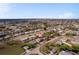 Aerial view of the home with a metal roof and solar panels in a neighborhood near a body of water at 450 Dalton Blvd, Port Charlotte, FL 33952