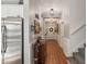 Beautiful hallway with wood floors, stylish decor, and direct access to kitchen at 4725 Arbor Gate Dr, Bradenton, FL 34203