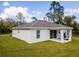 Well-maintained home featuring a covered patio and a spacious backyard, perfect for outdoor enjoyment at 4757 Vaquero St, North Port, FL 34286