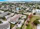 Wide aerial view of the community, highlighting the landscaping, pond, and surrounding buildings at 4802 51 W St # 1017, Bradenton, FL 34210