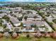 Aerial view showing the apartment buildings within a community, including parking and landscaping at 4802 51 W St # 1017, Bradenton, FL 34210