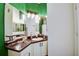 Bathroom featuring dual sinks, granite countertops, and modern lighting fixtures at 4802 51 W St # 1017, Bradenton, FL 34210